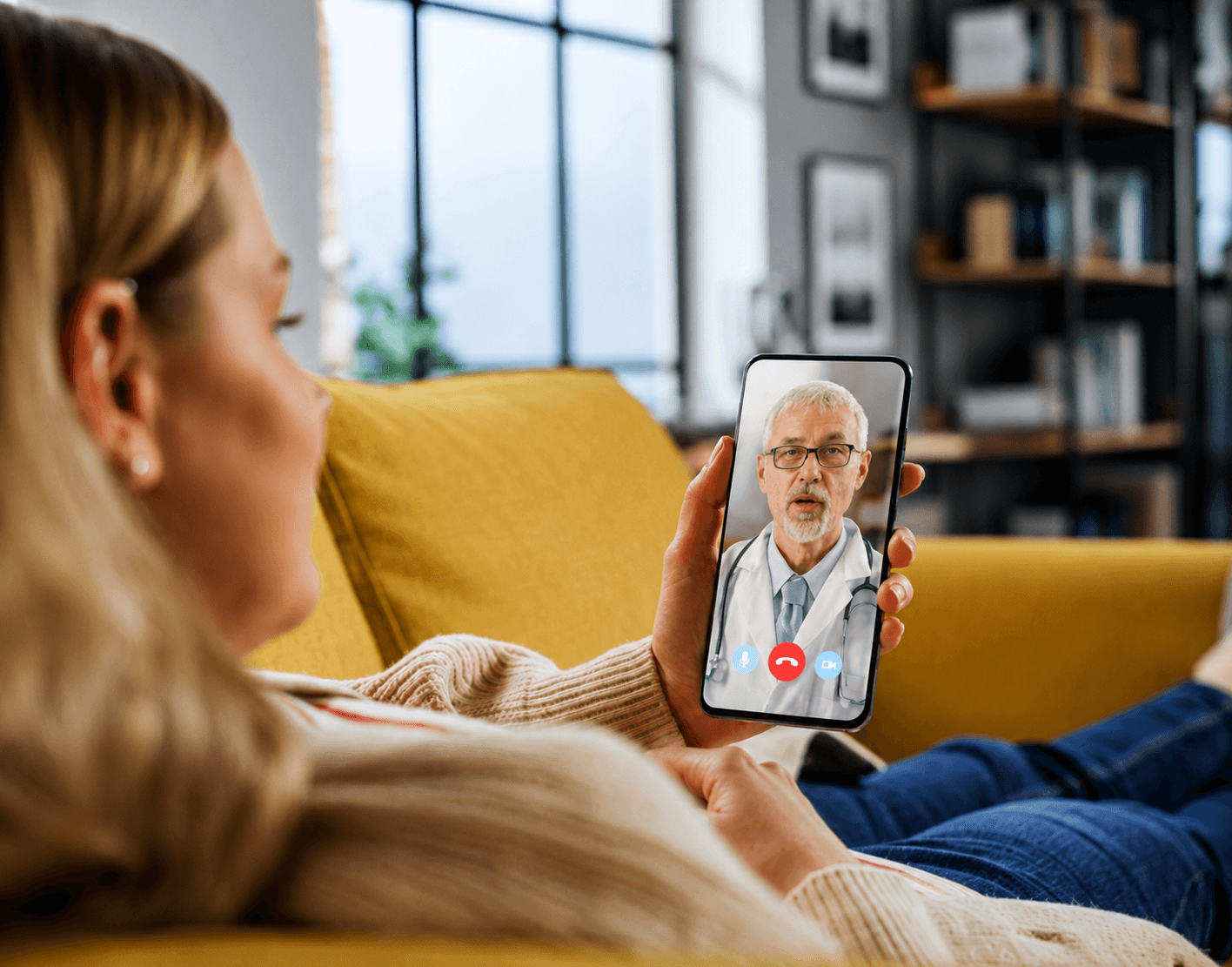 A patient video-consulting her doctor from home